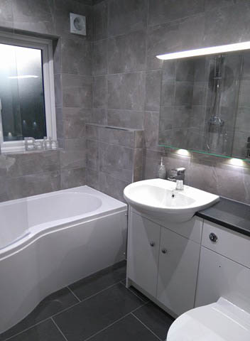 P shaped shower bath with fitted furniture